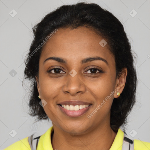 Joyful black young-adult female with medium  brown hair and brown eyes