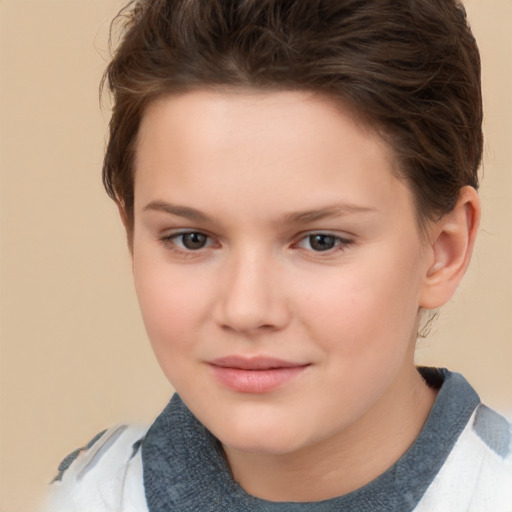 Joyful white child female with short  brown hair and brown eyes