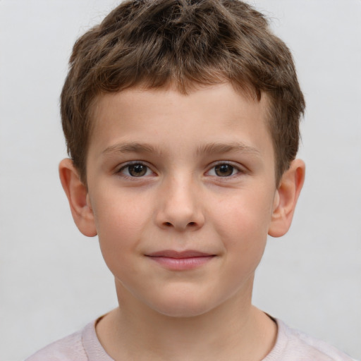 Joyful white child male with short  brown hair and brown eyes