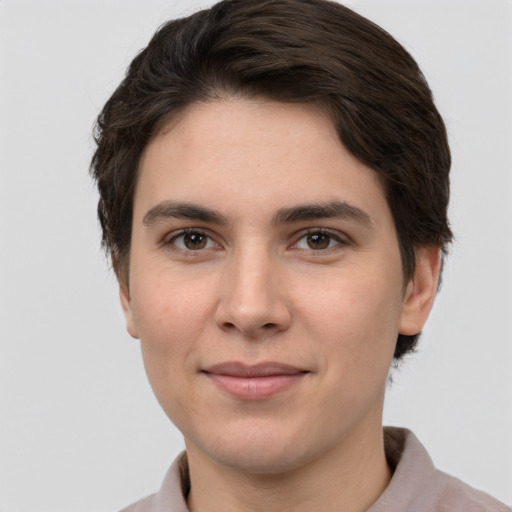 Joyful white young-adult female with short  brown hair and grey eyes