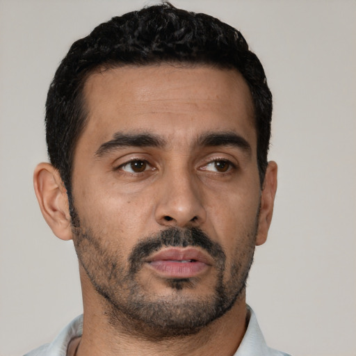 Neutral latino young-adult male with short  black hair and brown eyes