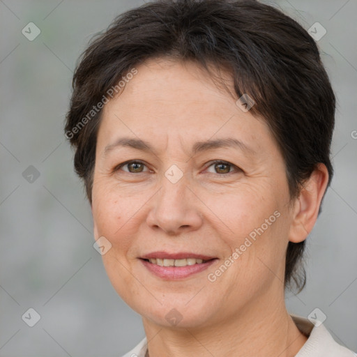 Joyful white adult female with short  brown hair and brown eyes