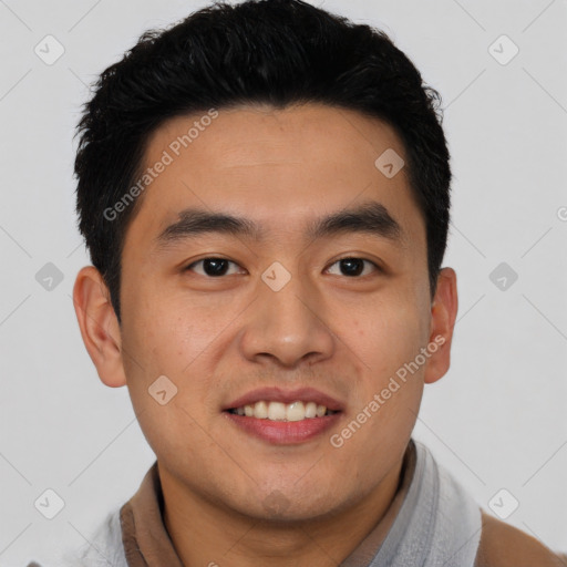 Joyful asian young-adult male with short  black hair and brown eyes