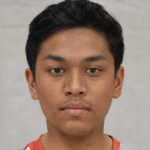 Neutral asian young-adult male with short  brown hair and brown eyes