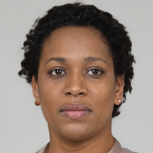 Neutral black adult female with short  brown hair and brown eyes