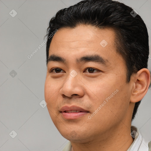 Joyful latino young-adult male with short  black hair and brown eyes