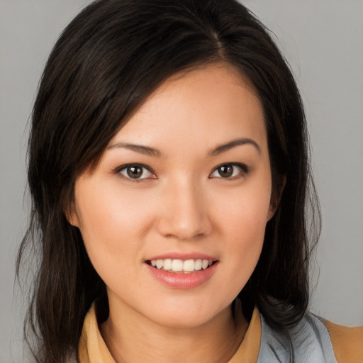 Joyful white young-adult female with medium  brown hair and brown eyes