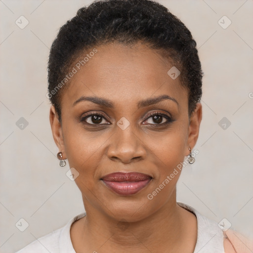 Joyful black young-adult female with short  black hair and brown eyes