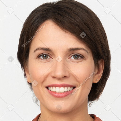 Joyful white young-adult female with medium  brown hair and brown eyes