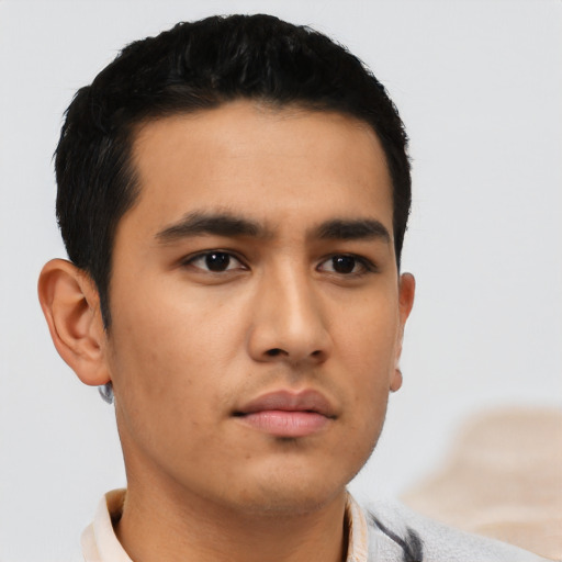 Neutral latino young-adult male with short  black hair and brown eyes