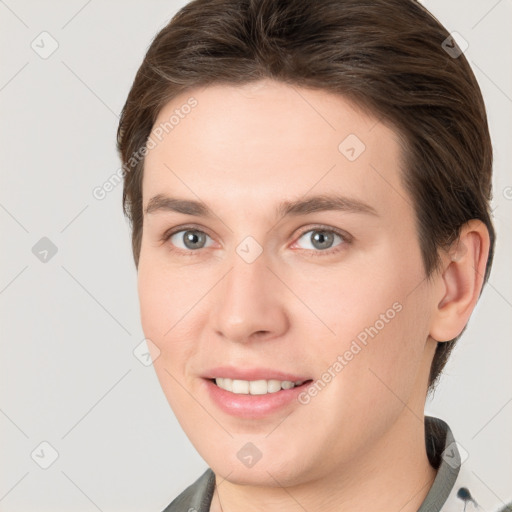 Joyful white young-adult female with short  brown hair and brown eyes