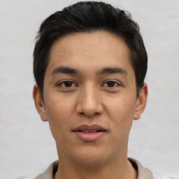 Joyful asian young-adult male with short  brown hair and brown eyes