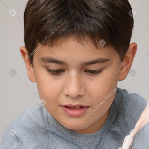 Joyful white child male with short  brown hair and brown eyes