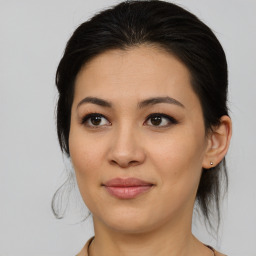 Joyful asian young-adult female with medium  brown hair and brown eyes