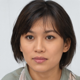 Neutral asian young-adult female with medium  brown hair and brown eyes