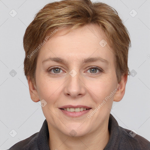 Joyful white adult female with short  brown hair and grey eyes