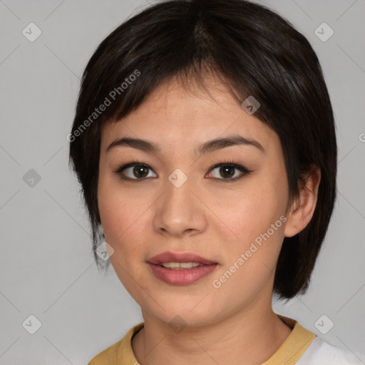 Joyful asian young-adult female with medium  brown hair and brown eyes