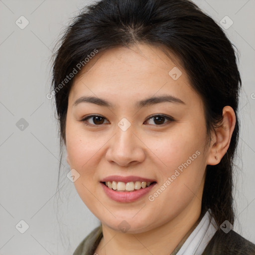 Joyful white young-adult female with medium  brown hair and brown eyes