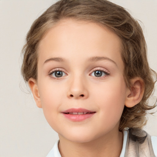 Joyful white child female with medium  brown hair and blue eyes