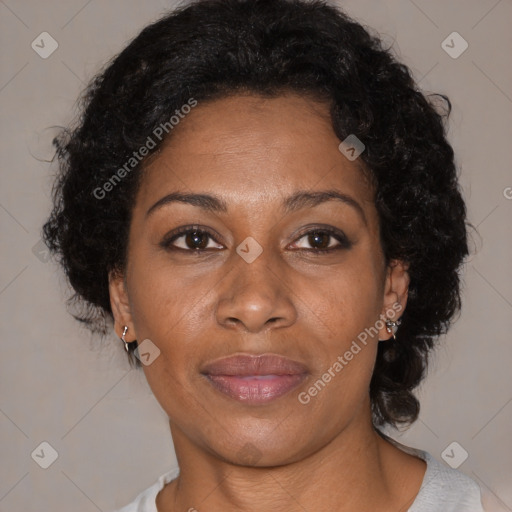 Joyful black adult female with short  brown hair and brown eyes