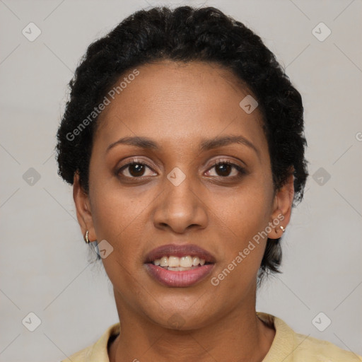 Joyful black young-adult female with short  brown hair and brown eyes