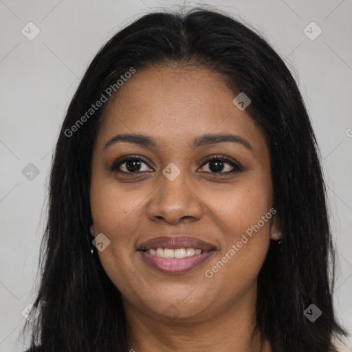 Joyful black young-adult female with long  brown hair and brown eyes