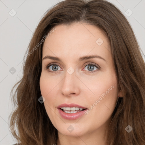 Joyful white young-adult female with long  brown hair and grey eyes