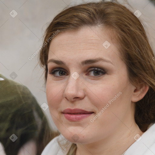 Joyful white adult female with medium  brown hair and brown eyes