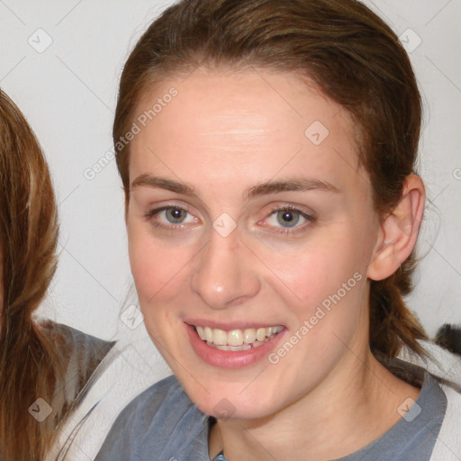 Joyful white young-adult female with medium  brown hair and blue eyes