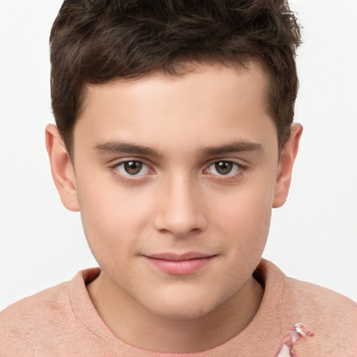 Joyful white child male with short  brown hair and brown eyes