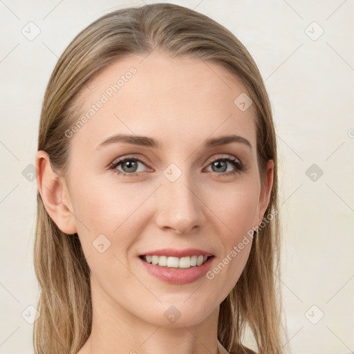 Joyful white young-adult female with long  brown hair and blue eyes