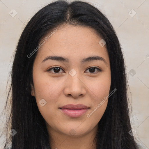 Joyful latino young-adult female with long  brown hair and brown eyes