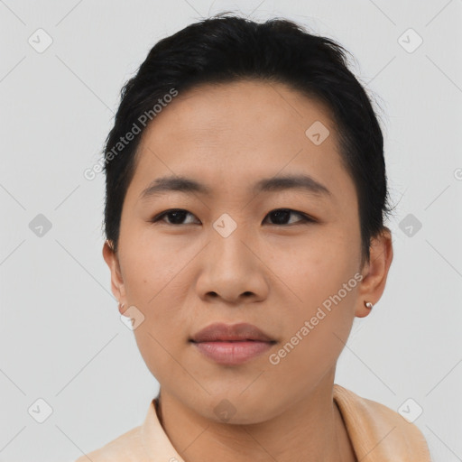 Joyful asian young-adult female with short  black hair and brown eyes