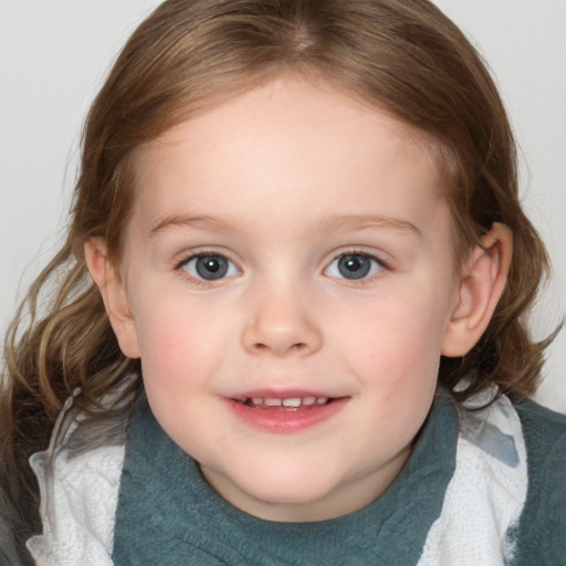 Joyful white child female with medium  brown hair and blue eyes