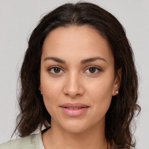 Joyful white young-adult female with long  brown hair and brown eyes