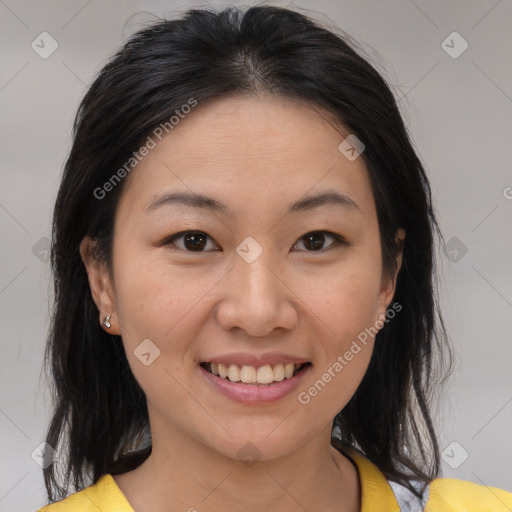 Joyful asian young-adult female with medium  brown hair and brown eyes