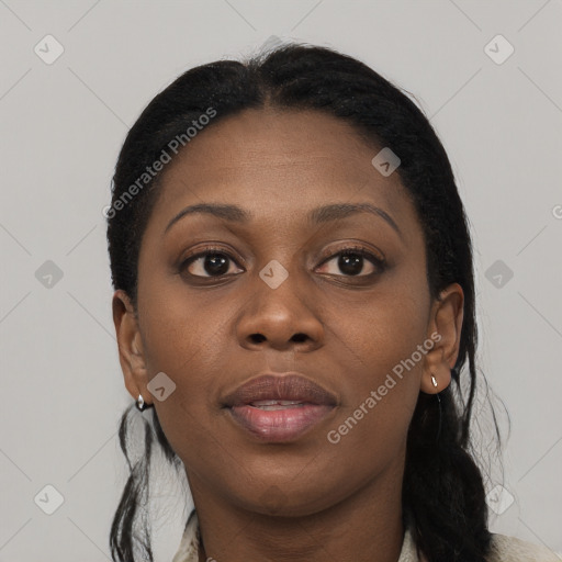 Joyful black young-adult female with long  black hair and brown eyes