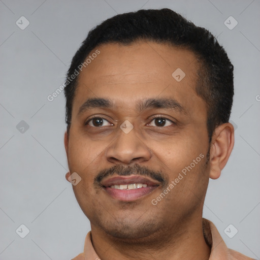 Joyful latino young-adult male with short  black hair and brown eyes