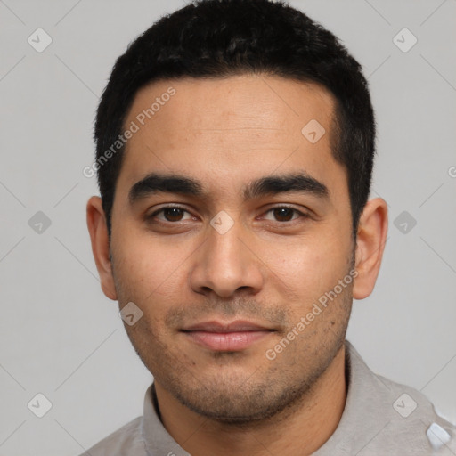 Joyful latino young-adult male with short  black hair and brown eyes