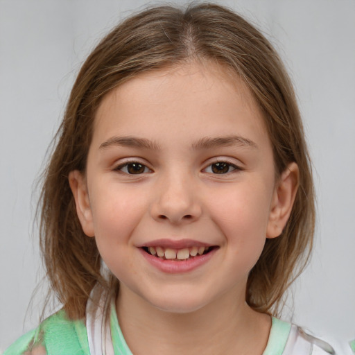 Joyful white child female with medium  brown hair and brown eyes