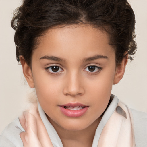 Joyful white child female with short  brown hair and brown eyes