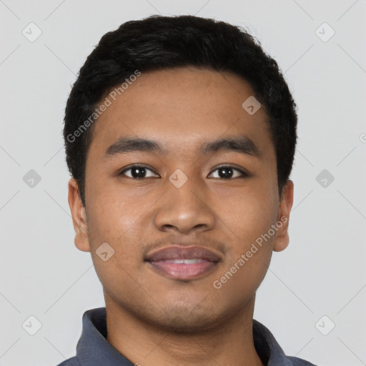 Joyful latino young-adult male with short  black hair and brown eyes