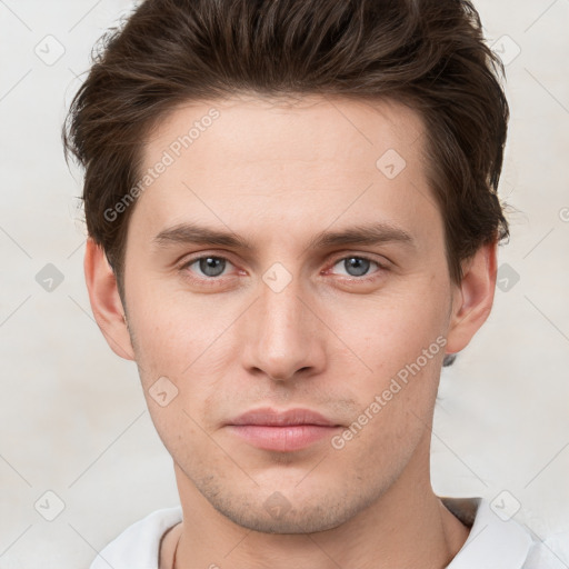 Neutral white young-adult male with short  brown hair and grey eyes