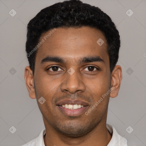 Joyful black young-adult male with short  black hair and brown eyes