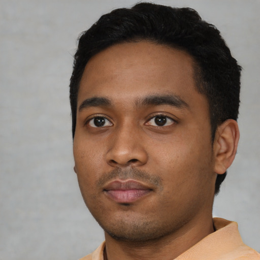 Neutral black young-adult male with short  black hair and brown eyes