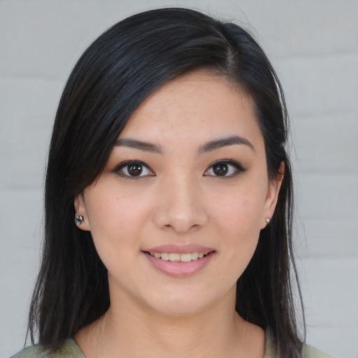 Joyful asian young-adult female with medium  brown hair and brown eyes