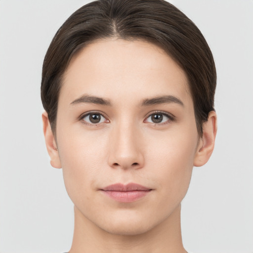 Neutral white young-adult female with short  brown hair and brown eyes