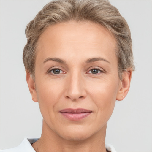 Joyful white adult female with short  brown hair and brown eyes