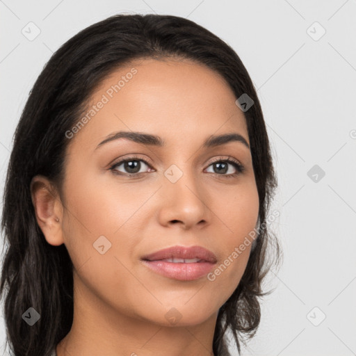 Joyful latino young-adult female with long  brown hair and brown eyes