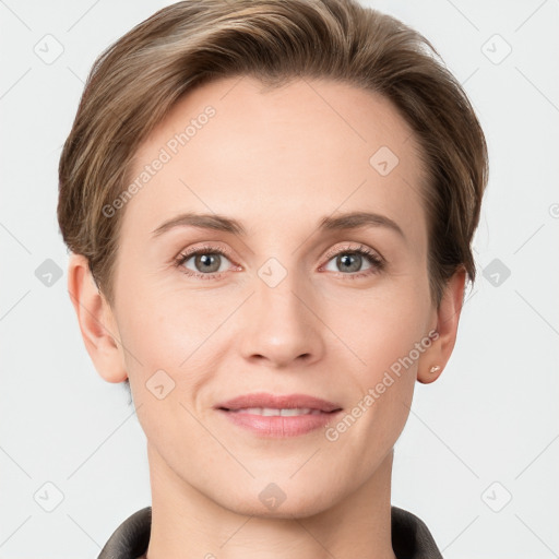 Joyful white young-adult female with short  brown hair and grey eyes